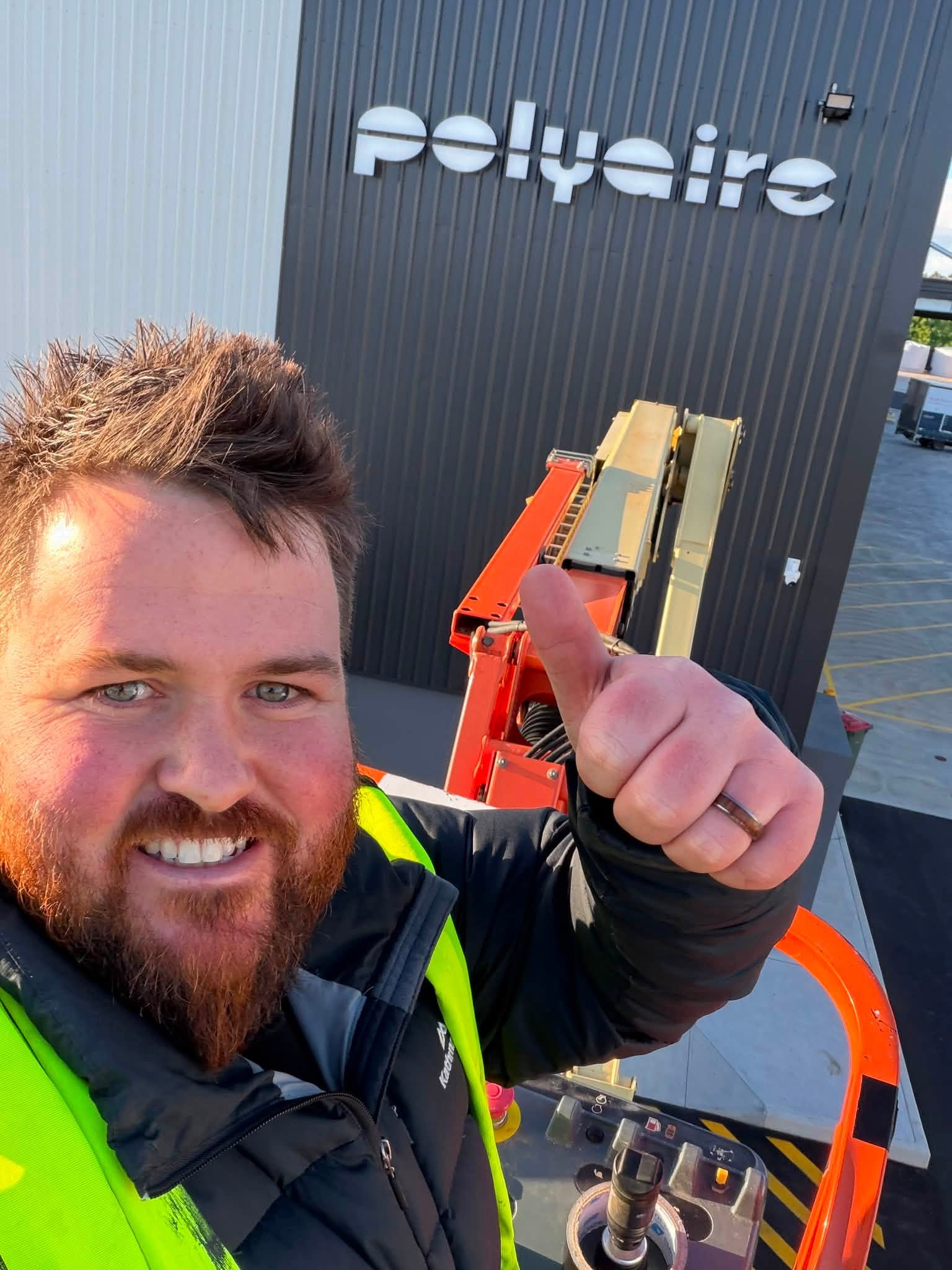 Tim Markham on a signage installation site
